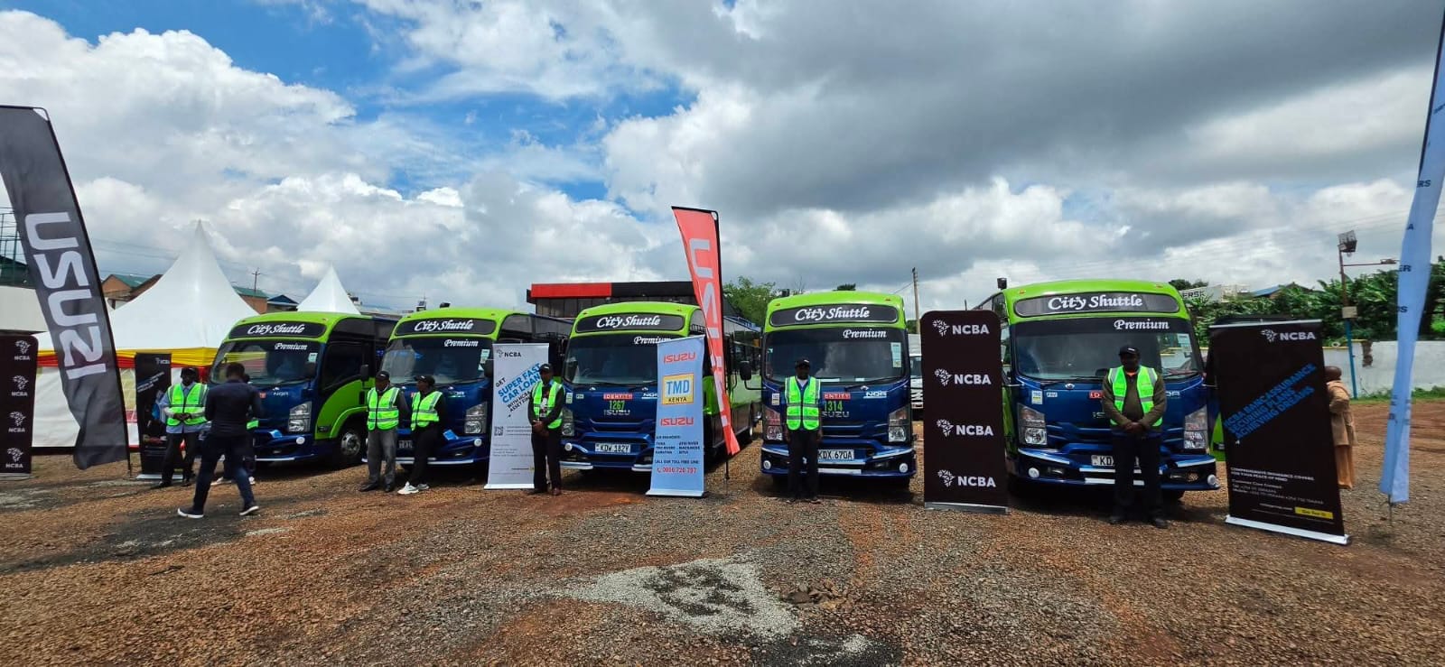 Fleet of Isuzu City Shuttle buses at a delivery event