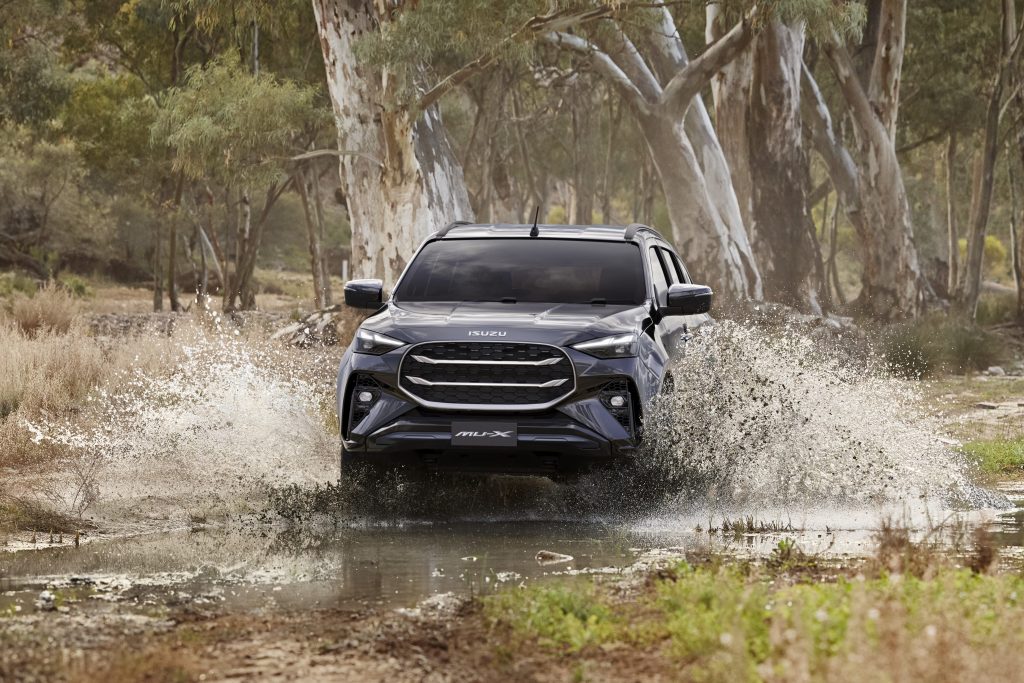 Isuzu mu-X driving through off-road terrain